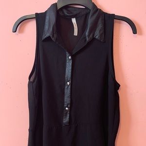 Black sleeveless button-up collared blouse